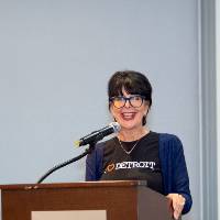 President Mantella standing at podium speaking